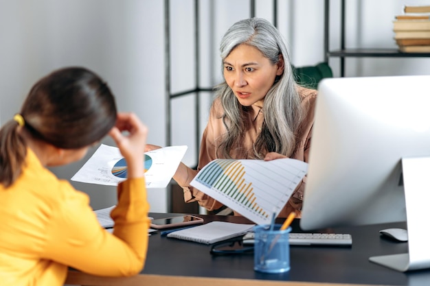 Comparing financial documentation approaches at a desk